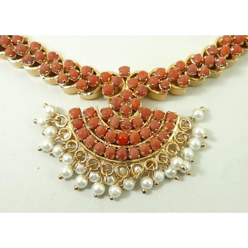 790 - An Indian coral necklace, the coral set in gold plated on silver, with a cord tie fastener, and a pa... 