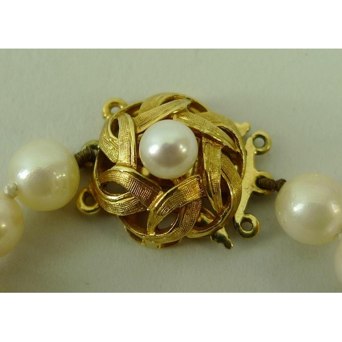 791 - A string of pearls with an 18ct gold rope twist clasp set with a single pearl, the 95 pearls separat... 