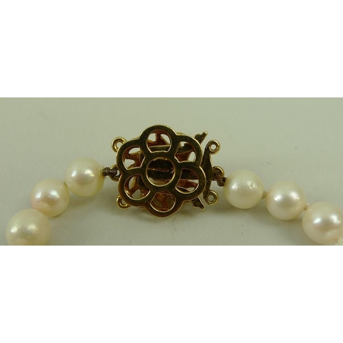 791 - A string of pearls with an 18ct gold rope twist clasp set with a single pearl, the 95 pearls separat... 