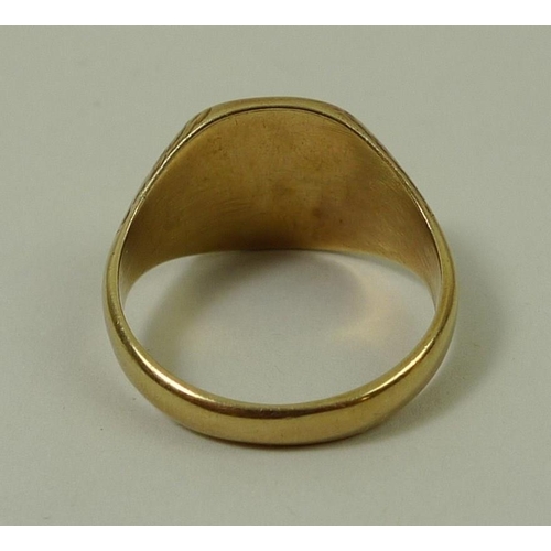 794 - A 9ct gold gentleman's signet ring, 9.2g.