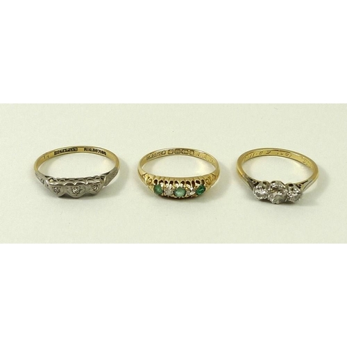 797 - An 18ct gold, diamond and emerald five stone ring, size N, an 18ct gold and diamond three stone ring... 