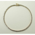 A diamond and 9ct gold tennis bracelet, formed of 91 separate diamond mounted links.