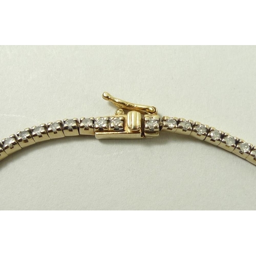 808 - A diamond and 9ct gold tennis bracelet, formed of 91 separate diamond mounted links.