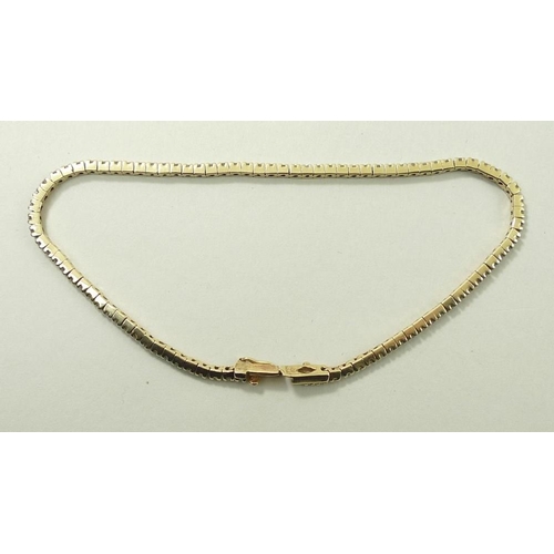 808 - A diamond and 9ct gold tennis bracelet, formed of 91 separate diamond mounted links.