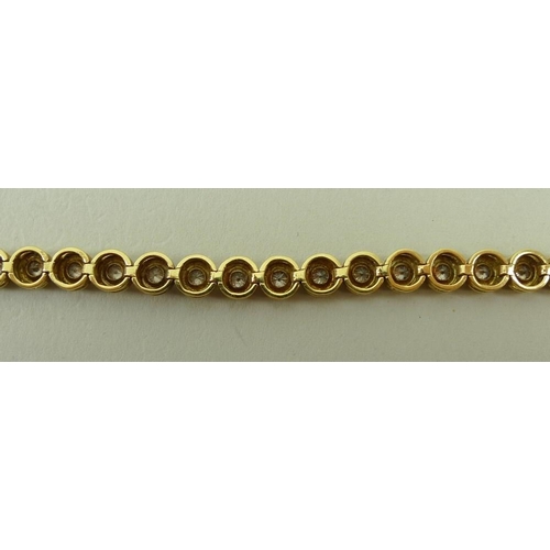 818 - An 18ct gold and diamond bracelet, set with thirty four diamonds, each individually within a circula... 