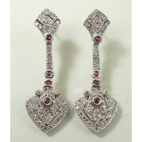 821 - A pair of drop earrings, set with diamonds and four rubies, the stud of diamond form leading to hear... 