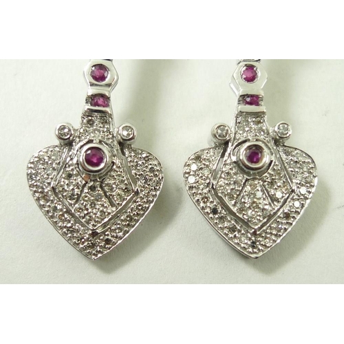 821 - A pair of drop earrings, set with diamonds and four rubies, the stud of diamond form leading to hear... 