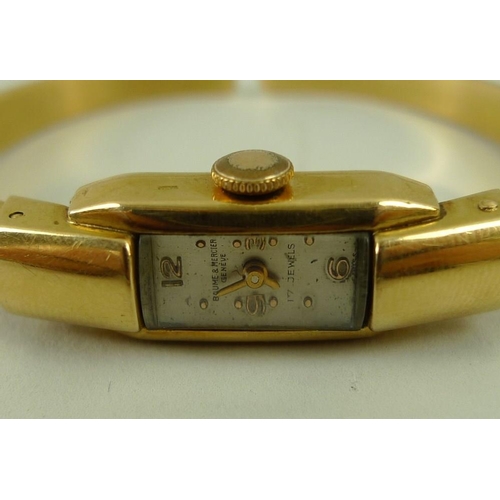 824 - A lady's Baume & Mercier 18ct gold bracelet watch, the tank cased watch with quarter Arabic numerals... 