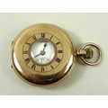 A 9ct gold cased half hunter pocket watch, the white face with Roman numerals and subsidiary dial, J... 