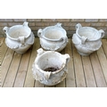 A group of four French garden urns, circa 1920, each cast with with three handles and swags of flowe... 