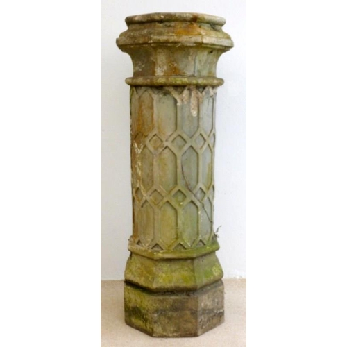 833 - A Jacobean style cast earthenware chimney pot, blind moulded with trellis work design, 42 by 14cm hi... 