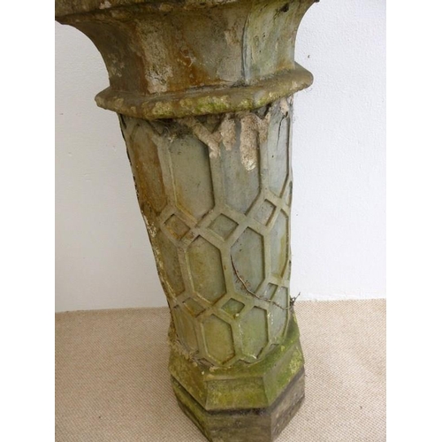 833 - A Jacobean style cast earthenware chimney pot, blind moulded with trellis work design, 42 by 14cm hi... 