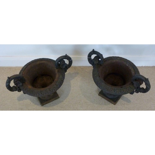 837 - A pair of campana cast iron garden urns, 51 by 35 by 39cm high.