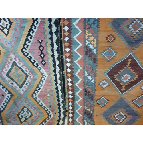 844 - Two early 20th century Kelim rugs, orange ground, 278 by 148cm, and pink ground, 268 by 134cm. (2)