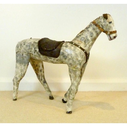 847 - A French carved wooden horse, circa 1900, painted dapple grey with leather saddle, a/f condition, 88... 