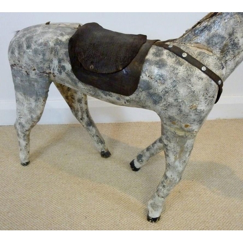 847 - A French carved wooden horse, circa 1900, painted dapple grey with leather saddle, a/f condition, 88... 