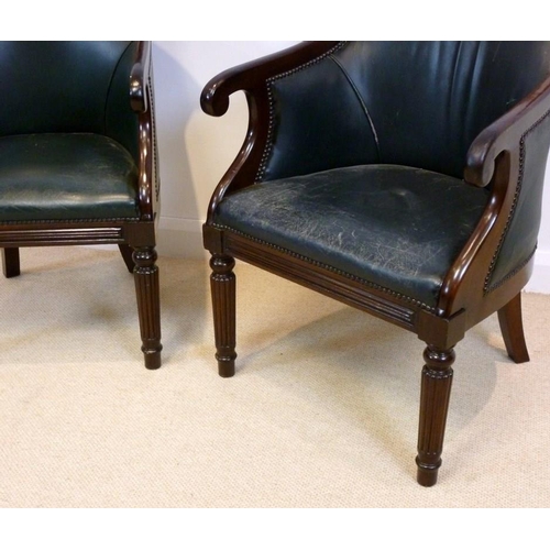 849 - A pair of modern reproduction library chairs, in the Regency style, upholstered with green leather, ... 