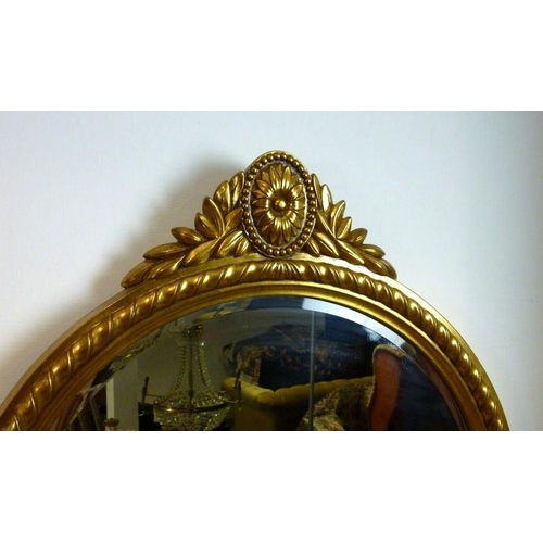 851 - A modern Belgian wall mirror, with domed top, the crest with chrysanthemum cartouche, bevelled glass... 