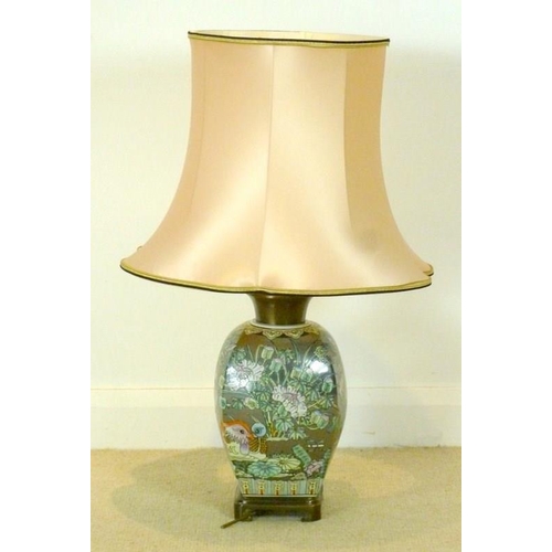 853 - A contemporary Chinese style ceramic table lamp, the silvered background and floral design with Mand... 