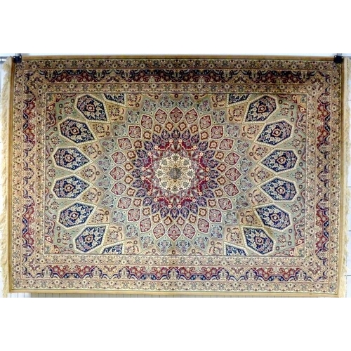 855A - A Keshan rug with fawn ground, central multi petalled medallion and radiating patterned field in red... 