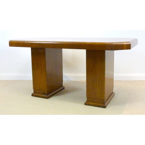 857 - An Art Deco oak veneered twin pedestal desk, the top with canted corners, 157 by 96 by 79cm high.