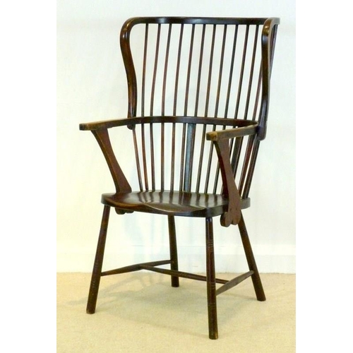 893 - A stained beechwood Windsor type open armchair, early 20th century, with shaped seat, comb back and ... 