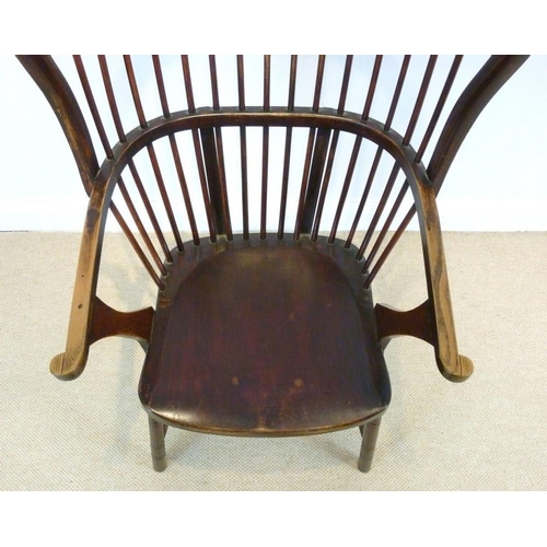 893 - A stained beechwood Windsor type open armchair, early 20th century, with shaped seat, comb back and ... 