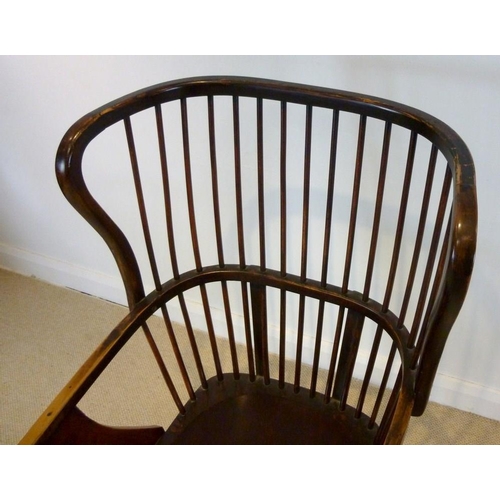 893 - A stained beechwood Windsor type open armchair, early 20th century, with shaped seat, comb back and ... 