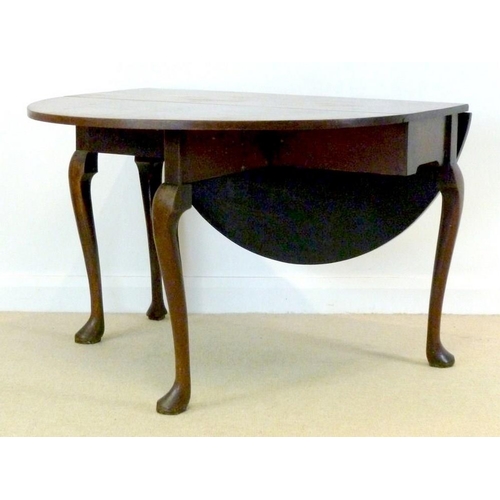 896 - A George I mahogany drop leaf table, oval surface with kick leg action, raised on cabriole supports ... 