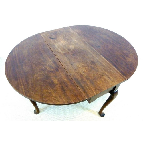 896 - A George I mahogany drop leaf table, oval surface with kick leg action, raised on cabriole supports ... 