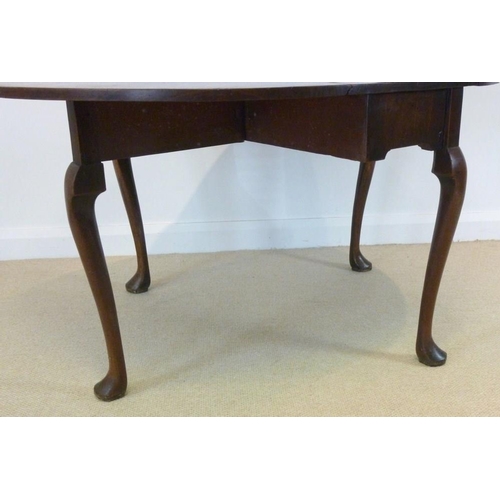 896 - A George I mahogany drop leaf table, oval surface with kick leg action, raised on cabriole supports ... 