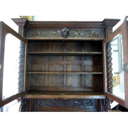 898 - A 19th century oak bookcase, in the 17th century Dutch style, deeply carved cornice over floral frie... 