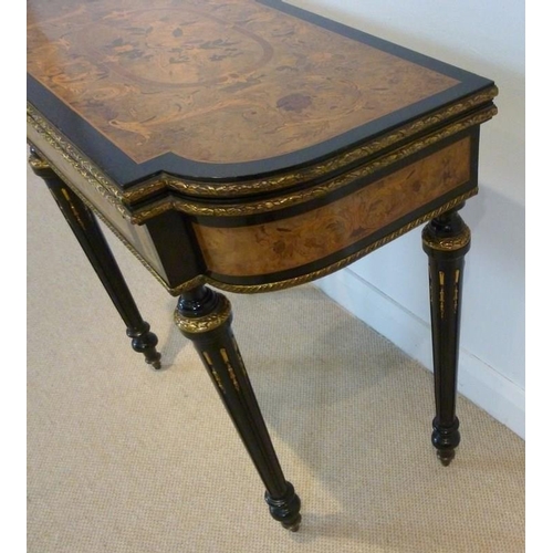 899 - A French 19th century, Louis Philippe, ebonised and ormolu mounted card table, the surface profusely... 