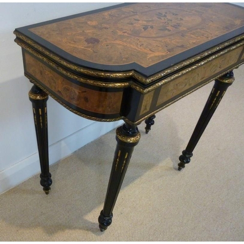 899 - A French 19th century, Louis Philippe, ebonised and ormolu mounted card table, the surface profusely... 