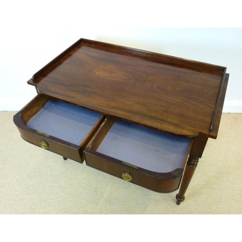 1027 - An early Victorian mahogany dressing table, circa 1840, the three quarter galleried bow fronted top ... 