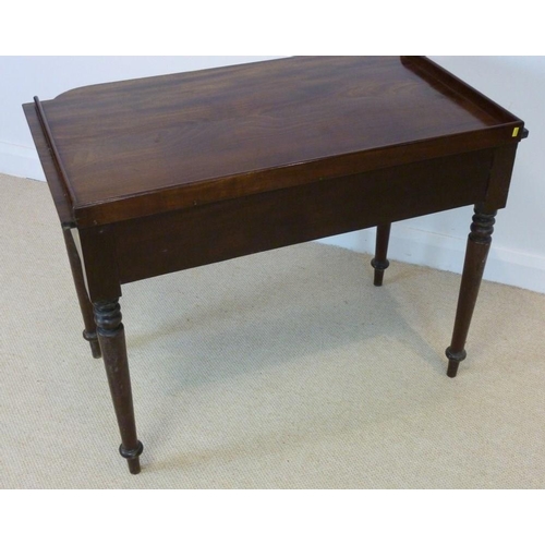 1027 - An early Victorian mahogany dressing table, circa 1840, the three quarter galleried bow fronted top ... 