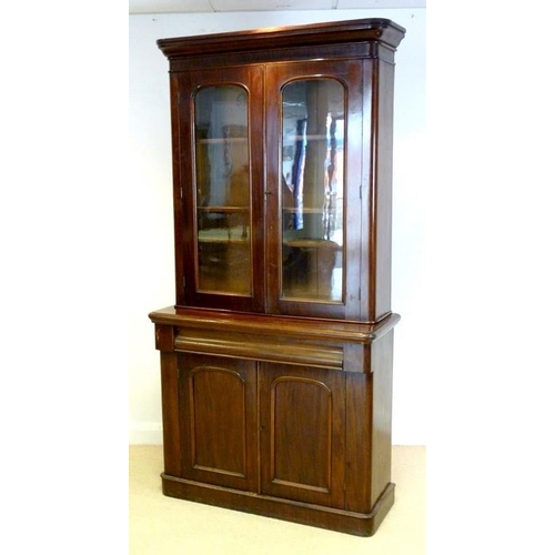 1031 - A late Victorian mahogany glazed bookcase, 107 by 42 by 210cm high.