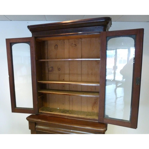 1031 - A late Victorian mahogany glazed bookcase, 107 by 42 by 210cm high.