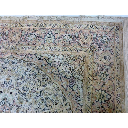 1032 - A Kashmiri silk and wool finely knotted rug, pink ground, 276 by 178cm, with a receipt from the Trib... 