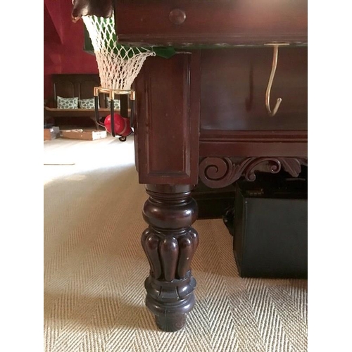 1033 - A full sized billiards table in the William IV style, on mahogany lobed baluster legs, by Palmer and... 