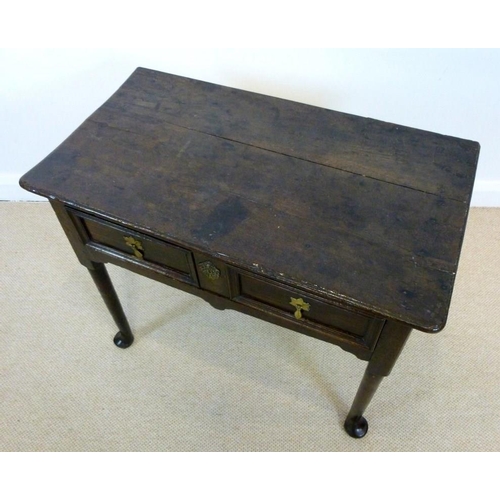 1036 - A George I oak lowboy, circa 1720, the rectangular surface with moulded edge over a single frieze dr... 