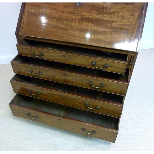 1039 - A George III style mahogany bureau bookcase, circa 1880, the cavetto cornice above a pair of geometr... 