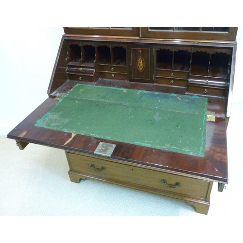 1039 - A George III style mahogany bureau bookcase, circa 1880, the cavetto cornice above a pair of geometr... 