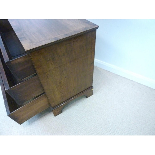 1053 - A George I walnut chest, the crossbanded rectangular top with a moulded edge over three long crossba... 