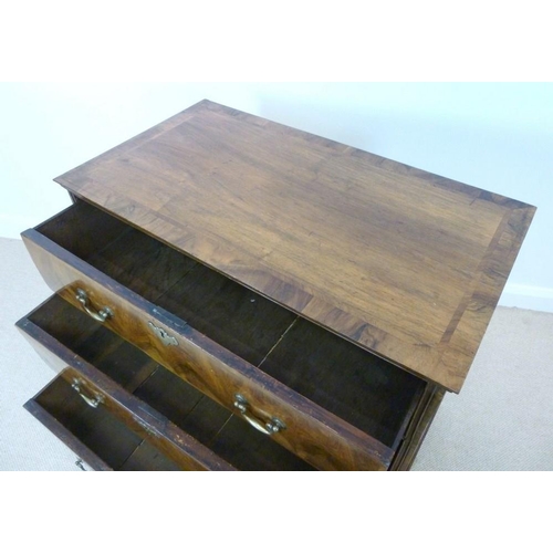 1053 - A George I walnut chest, the crossbanded rectangular top with a moulded edge over three long crossba... 