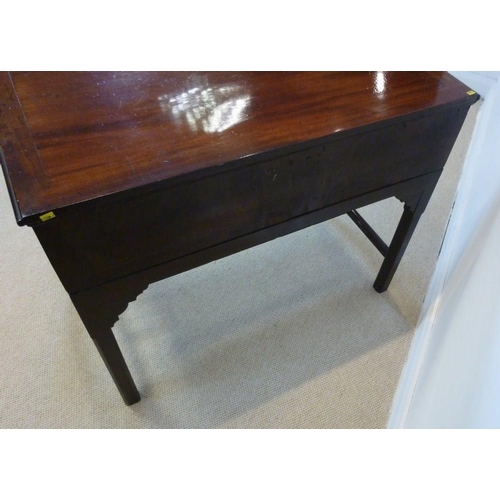 1054 - An early George III mahogany side table, circa 1760, the rectangular top with a moulded edge above a... 