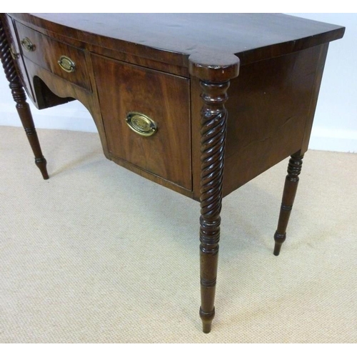 1055 - A Regency mahogany bowfront sideboard, circa 1820, the top with outset rounded corners over one shal... 