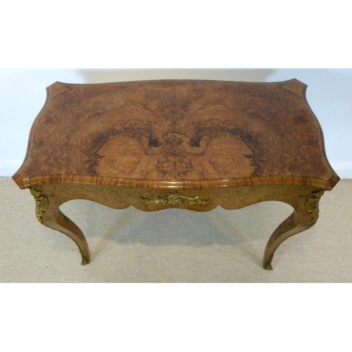 1059 - A Victorian burr walnut card table, circa 1870, the mirror veneered serpentine top with a moulded ed... 