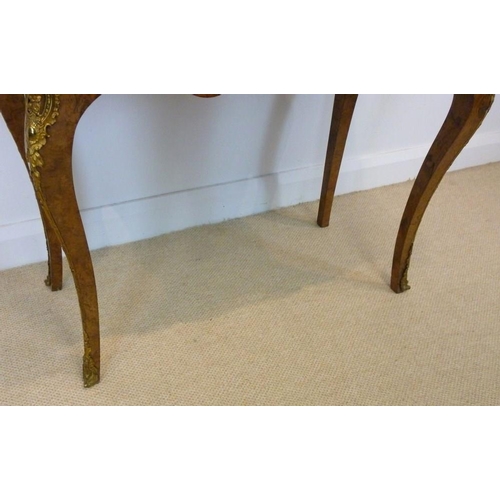 1059 - A Victorian burr walnut card table, circa 1870, the mirror veneered serpentine top with a moulded ed... 