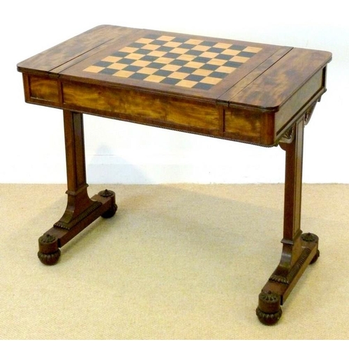 1060 - A William IV mahogany games table, circa 1830, the rounded rectangular top with a reversible games b... 